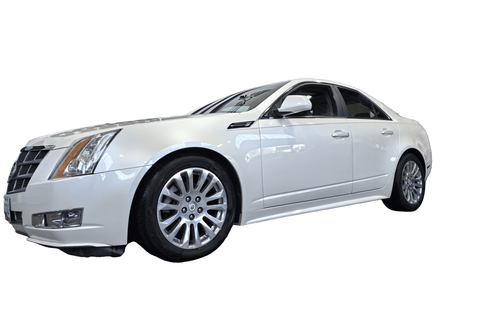 A white Cadillac CTS with a deep, mirror-flat ceramic finish after paint correction at Mr. G's Auto Care in Westminster, MD