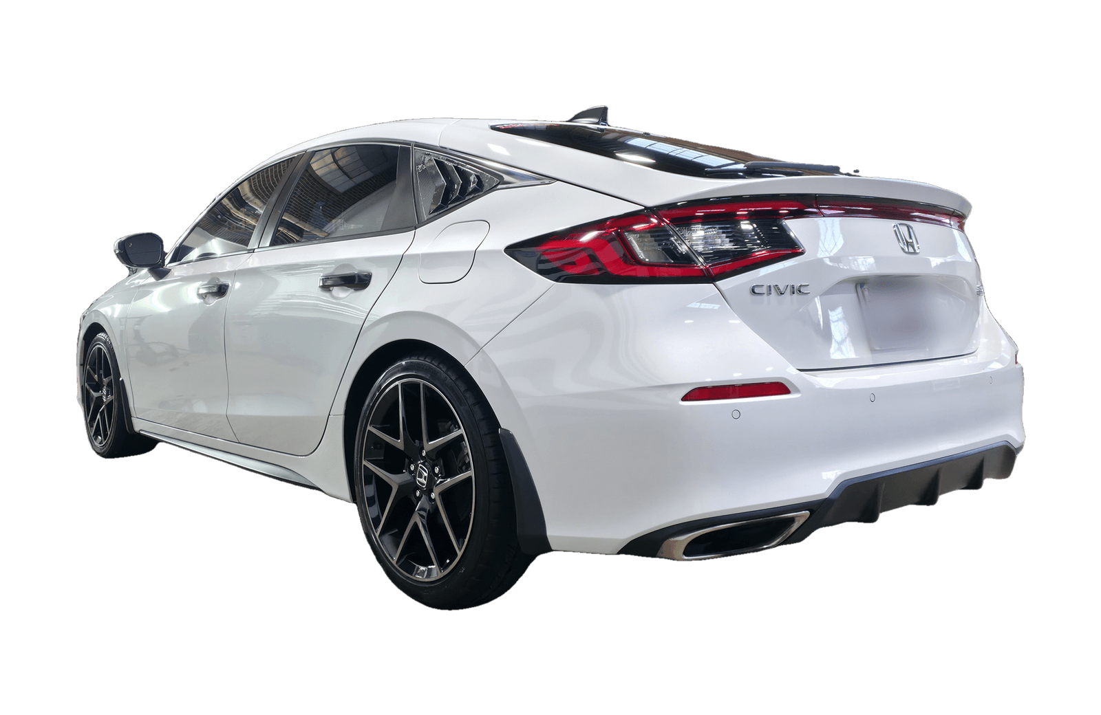 A glossy white Honda Civic Sport finished with a 3-year ceramic coating, rear three quarter view, in Carroll County, MD