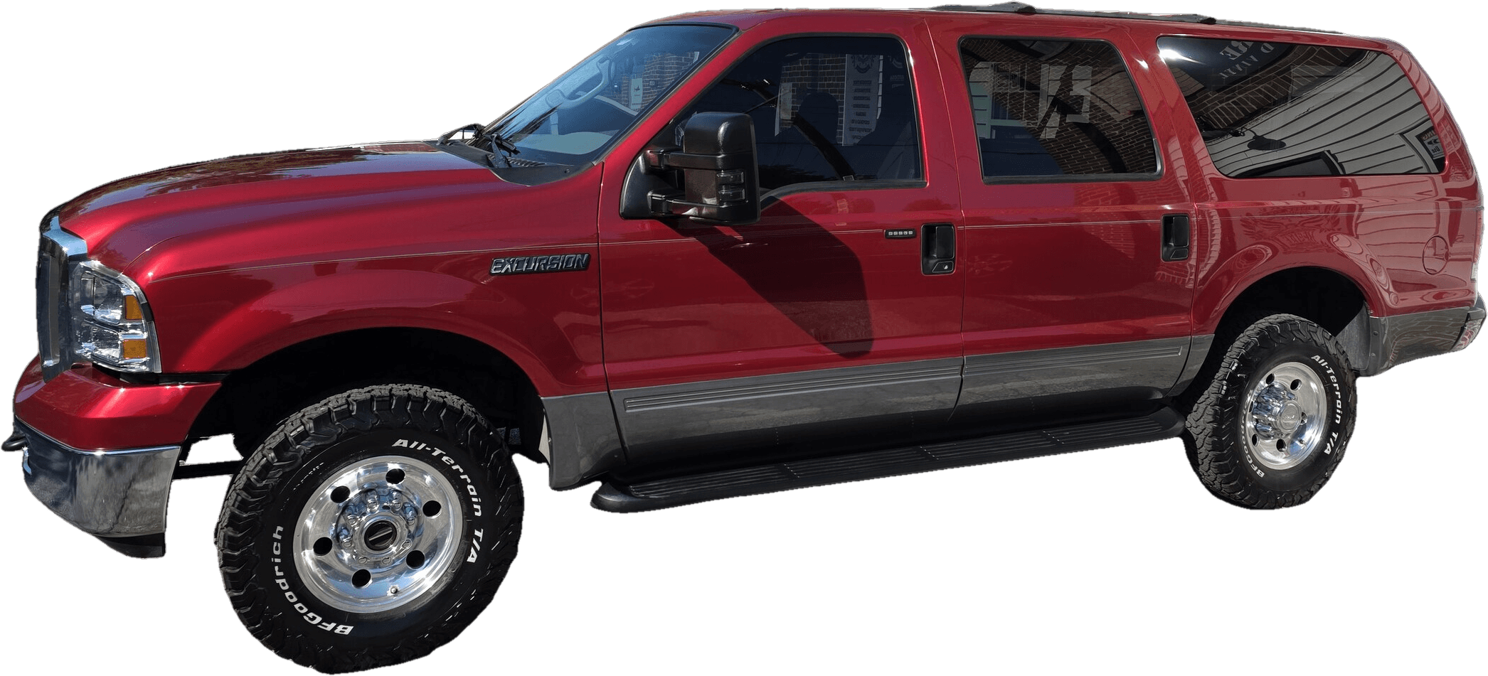 A glossy red Ford Excursion with deep, reflective paint after a ceramic coating by Mr. G's Auto Care in Westminster, MD