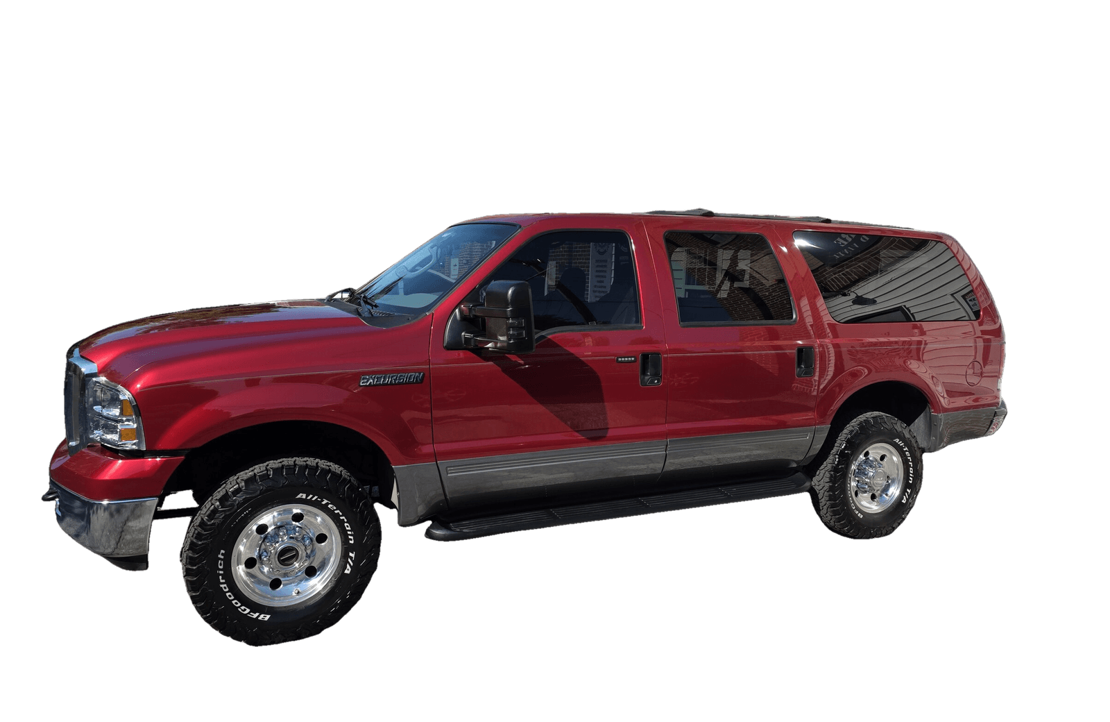 A glossy red Ford Excursion with deep, reflective paint after a ceramic coating by Mr. G's Auto Care in Westminster, MD
