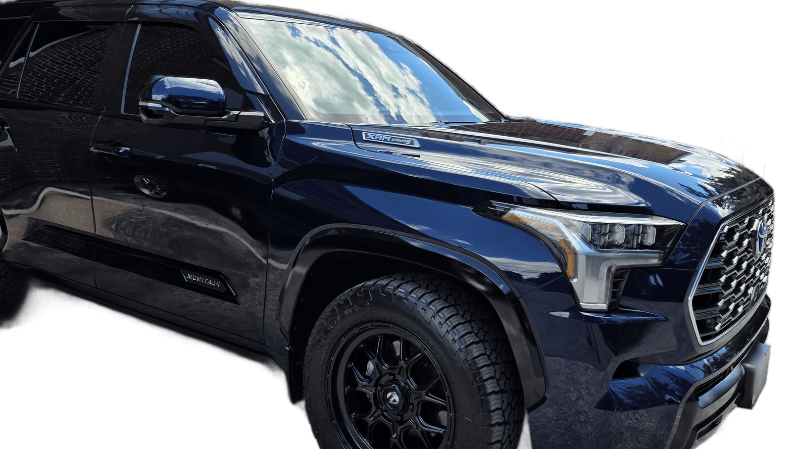A dark blue Toyota Sequoia with a deep, glossy ceramic coated finish by Mr. G's Auto Care in Westminster, MD