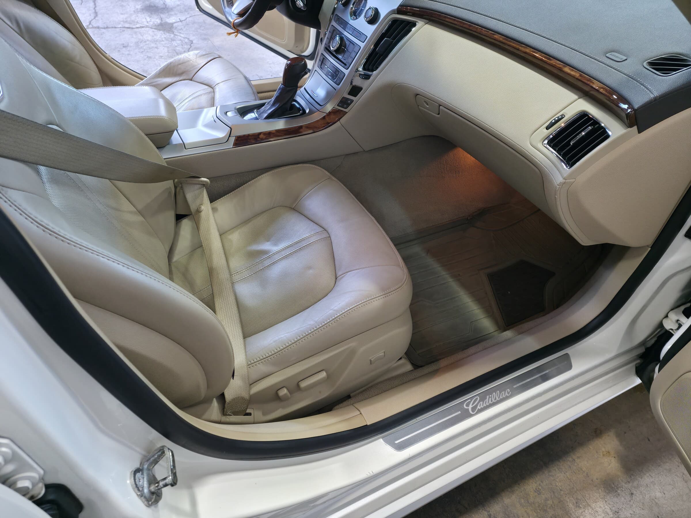 Conditioned cream leather seats and wood trim after a full interior detail at Mr. G's Auto Care in Westminster, MD