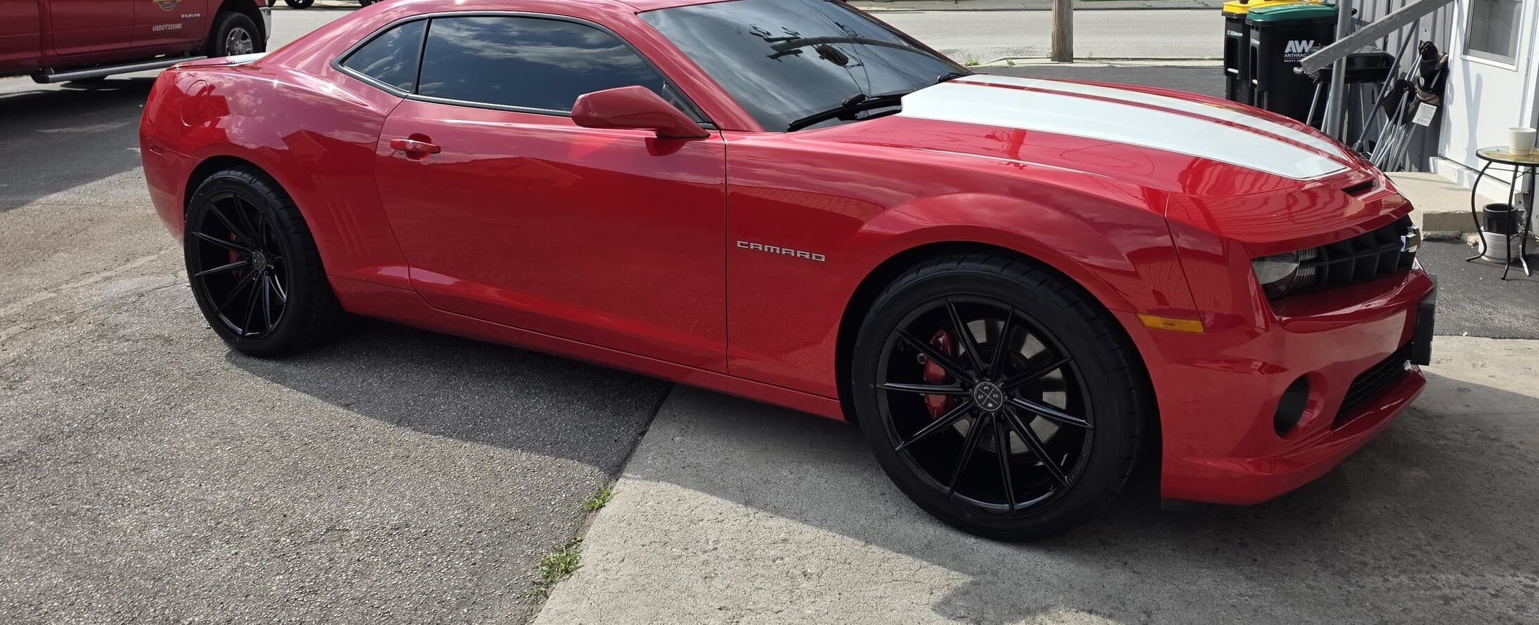 A glossy red Chevrolet Camaro with corrected paint, photographed outdoors in Carroll County, MD