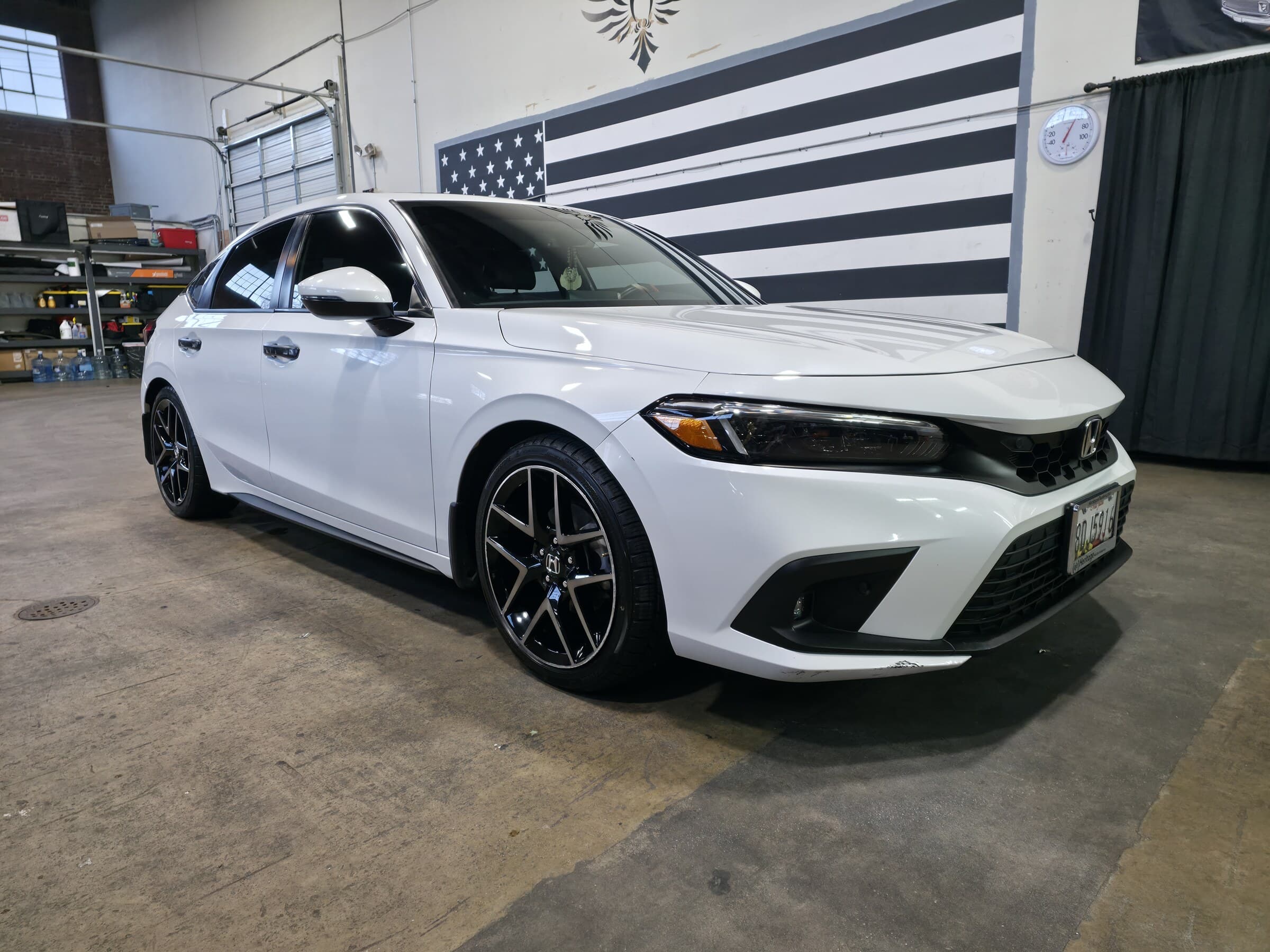 A white Honda Civic detailed to a clean, even gloss at Mr. G's Auto Care in Westminster, MD